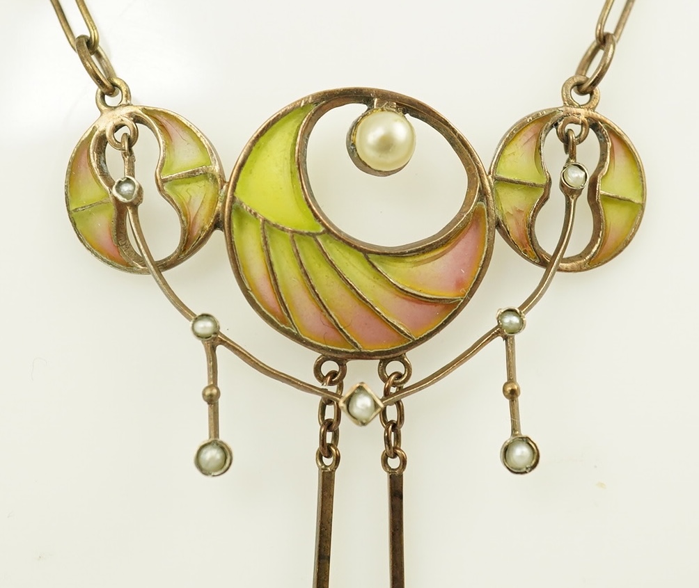 An early 20th century French silver gilt, baroque and seed pearl set plique a jour enamel pendant necklace